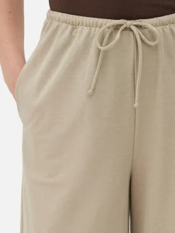 Calças Cordão Corte Perna Direita